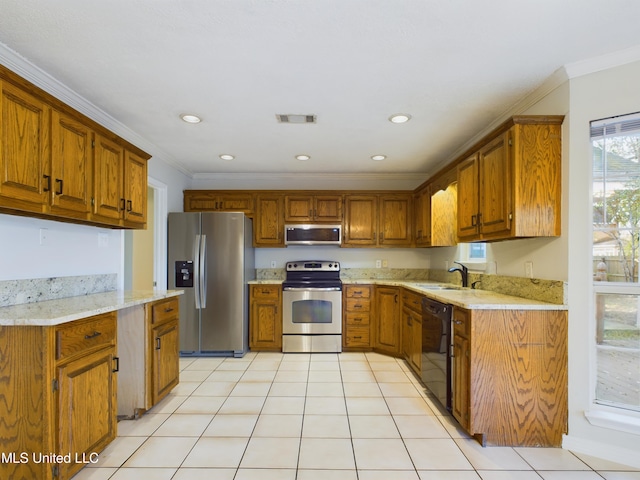 kitchen featuring sink, light stone countertops, ornamental molding, light tile patterned floors, and stainless steel appliances