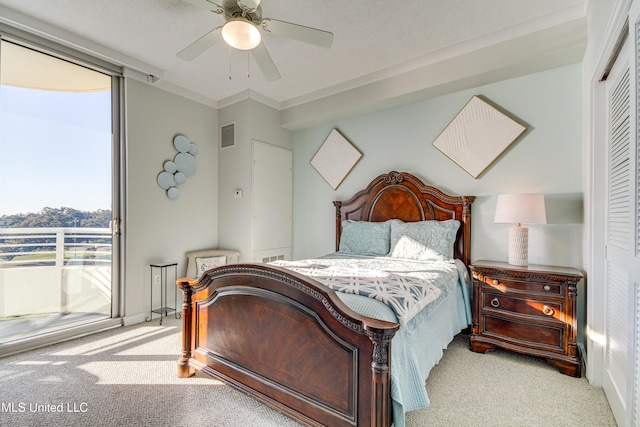 bedroom featuring ceiling fan, visible vents, carpet, and access to exterior