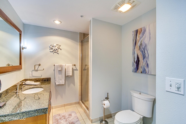 bathroom with tile patterned flooring, visible vents, toilet, a shower with shower door, and vanity