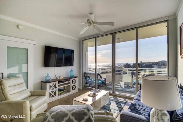 tiled living room featuring ceiling fan, crown molding, and expansive windows