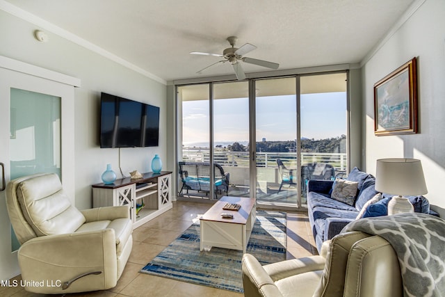 tiled living area with floor to ceiling windows, crown molding, and ceiling fan