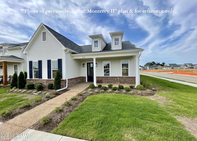 view of front facade featuring a front yard