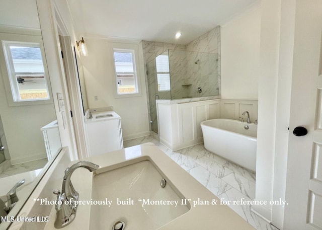 bathroom with ornamental molding, vanity, and separate shower and tub