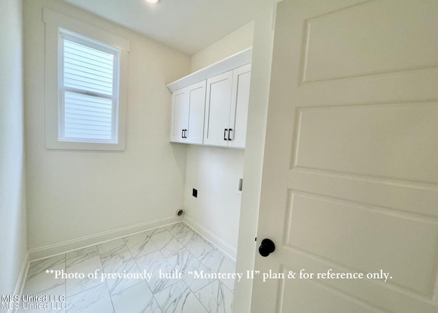 laundry room with cabinets and hookup for an electric dryer