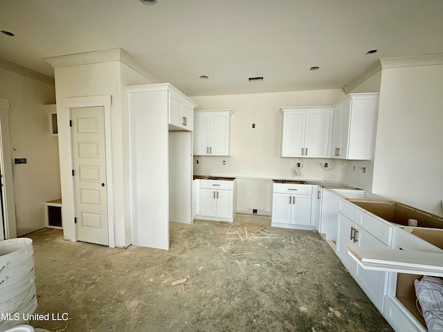 kitchen featuring white cabinets