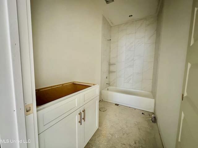 bathroom featuring vanity and tiled shower / bath combo