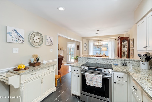 453 Cherry Tree Ln, Southaven, MS 38671 - kitchen with stainless steel range with electric stovetop, a peninsula, white cabinetry, dark tile patterned floors, and recessed lighting