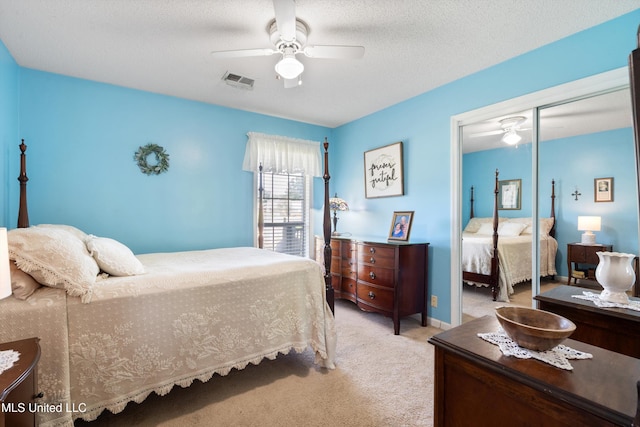 453 Cherry Tree Ln, Southaven, MS 38671 - bedroom with light carpet, a closet, and a ceiling fan