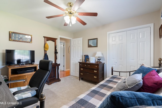 453 Cherry Tree Ln, Southaven, MS 38671 - bedroom with light colored carpet, a closet, a desk, and ceiling fan