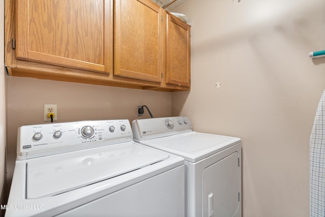453 Cherry Tree Ln, Southaven, MS 38671 - laundry area with cabinet space and washer and clothes dryer
