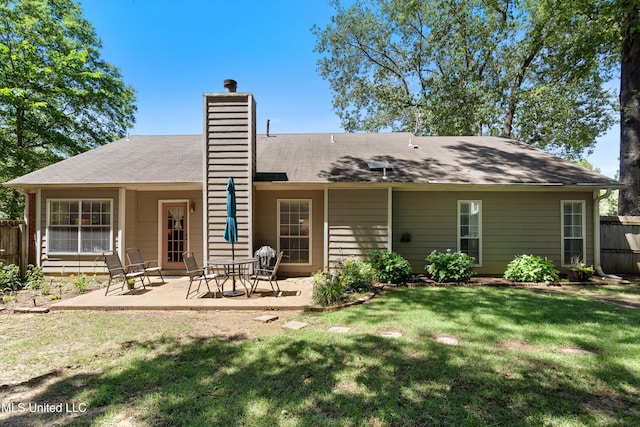453 Cherry Tree Ln, Southaven, MS 38671 - back of house featuring a chimney and a patio area