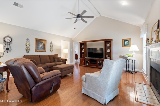 453 Cherry Tree Ln, Southaven, MS 38671 - living room with a fireplace, ceiling fan, beam ceiling, wood-type flooring, and baseboards
