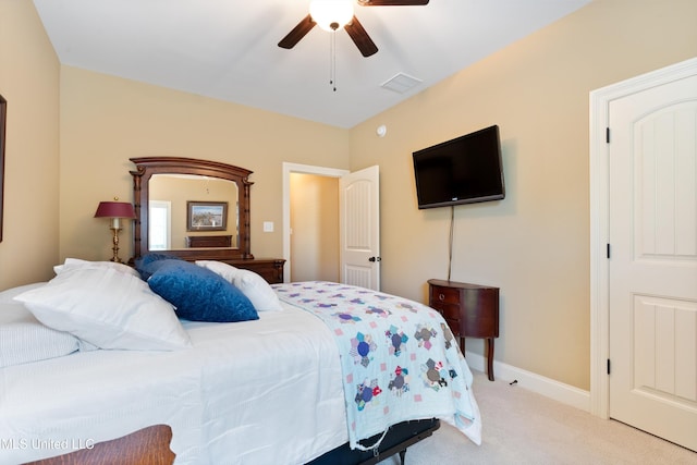 bedroom featuring ceiling fan and light carpet