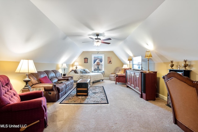 bedroom with light colored carpet, vaulted ceiling, and ceiling fan