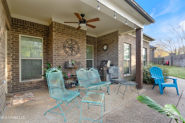 view of patio / terrace featuring area for grilling and ceiling fan