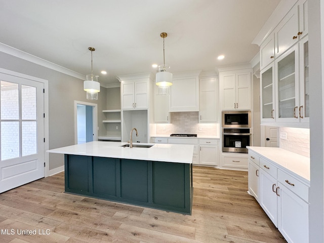 kitchen with white cabinets, glass insert cabinets, light countertops, and oven