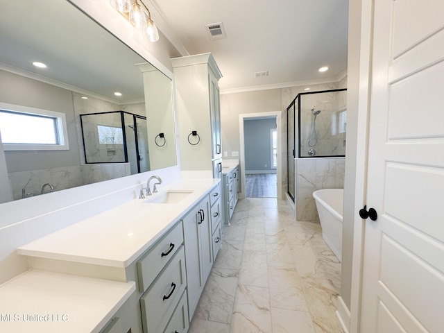 bathroom featuring a freestanding tub, visible vents, marble finish floor, ornamental molding, and a stall shower