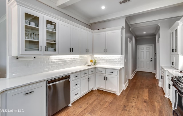 kitchen featuring light wood finished floors, white cabinets, dishwasher, and light countertops