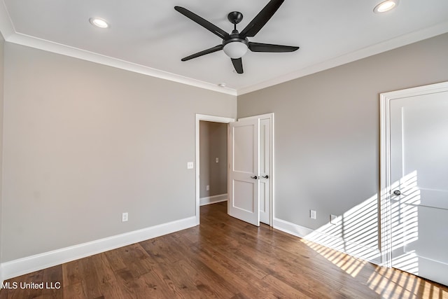 unfurnished bedroom with recessed lighting, crown molding, baseboards, and wood finished floors