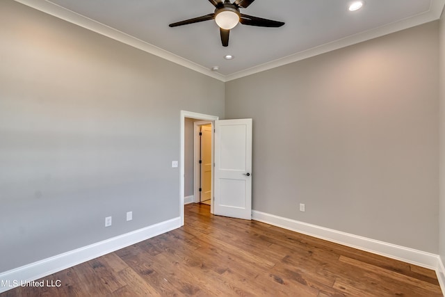 spare room with crown molding, recessed lighting, ceiling fan, wood finished floors, and baseboards