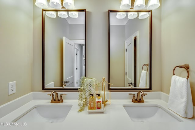 bathroom with double vanity and a sink