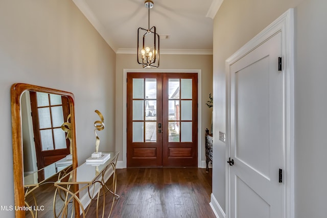 entryway featuring baseboards, dark wood-style floors, ornamental molding, an inviting chandelier, and french doors