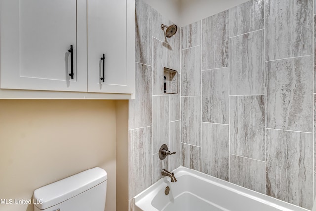 bathroom featuring toilet and shower / washtub combination