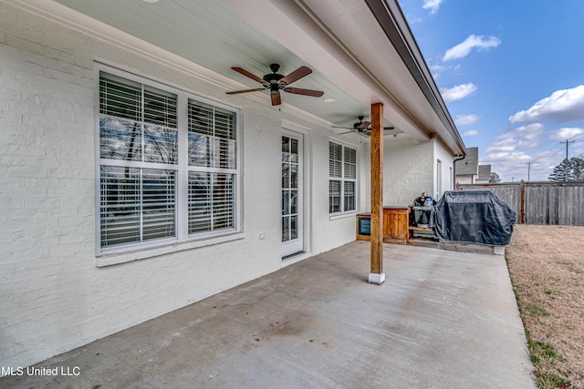 view of patio / terrace featuring ceiling fan, a grill, and fence