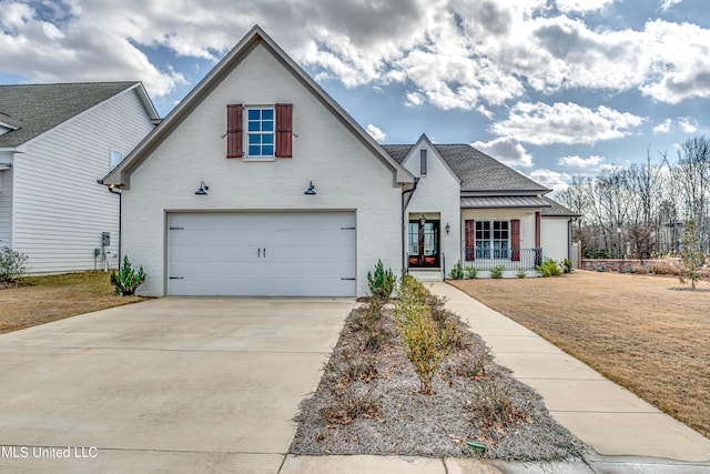 view of front of property featuring brick siding, concrete driveway, an attached garage, a porch, and a front yard