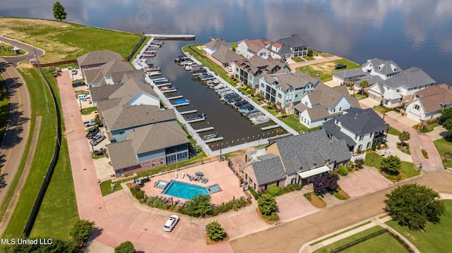 bird's eye view with a water view and a residential view