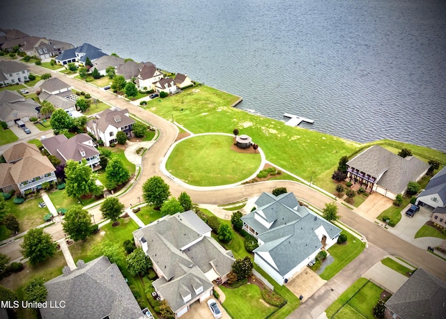 birds eye view of property featuring a water view and a residential view