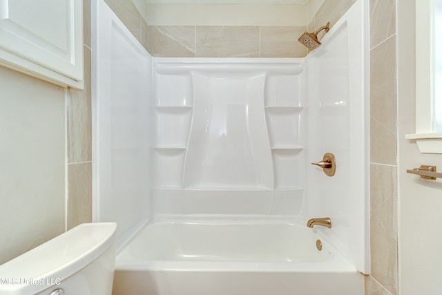 bathroom with toilet and tub / shower combination