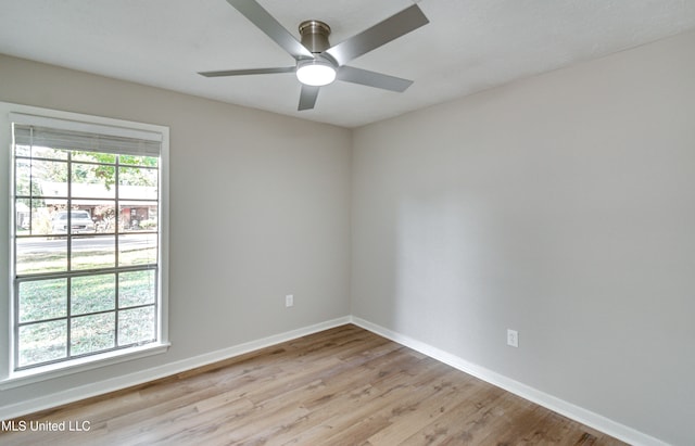 unfurnished room featuring light hardwood / wood-style flooring and ceiling fan