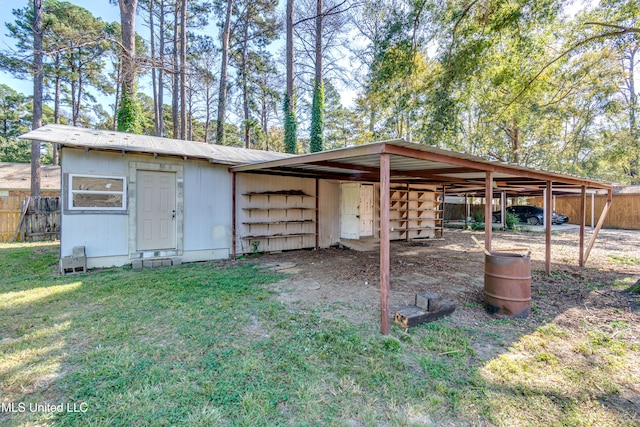 view of outbuilding with a yard