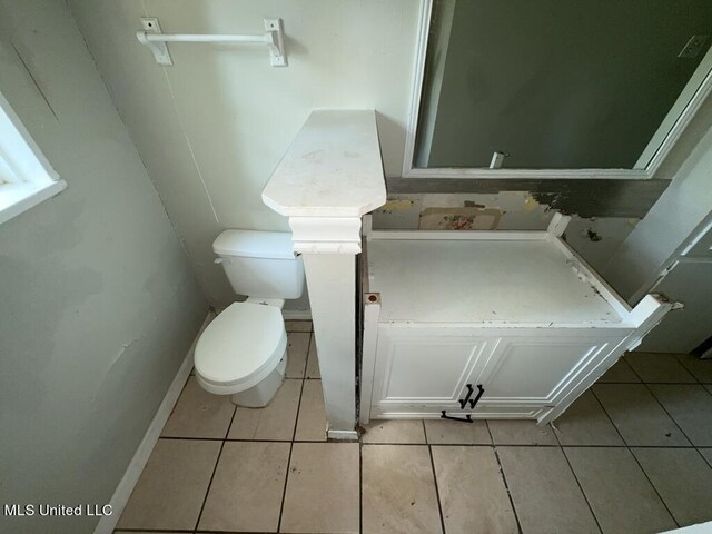 bathroom featuring toilet and tile patterned floors