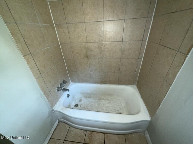 bathroom featuring a bathing tub and tile patterned flooring