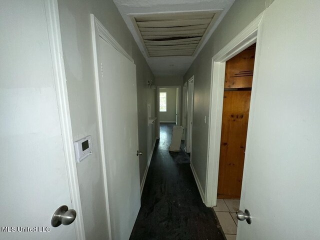 corridor with dark tile patterned floors