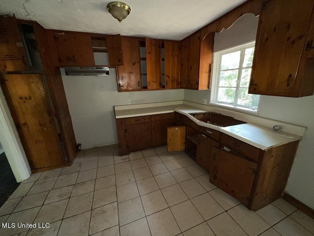 kitchen with light tile patterned floors