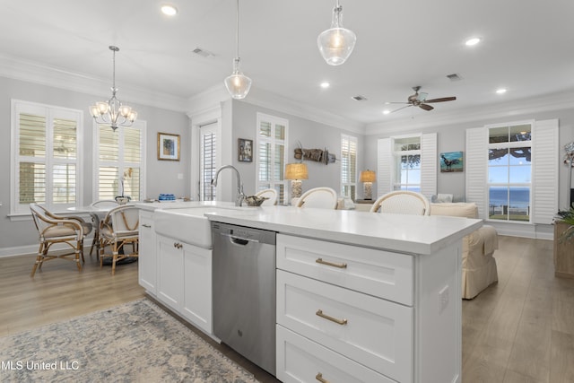 kitchen featuring ornamental molding, visible vents, and dishwasher