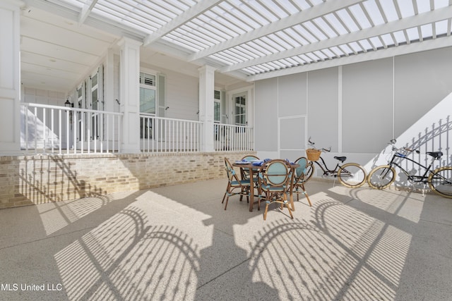 view of patio / terrace with outdoor dining area and a pergola