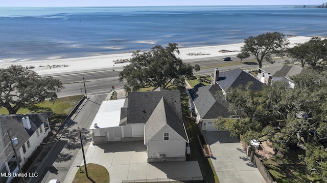 bird's eye view with a water view and a view of the beach