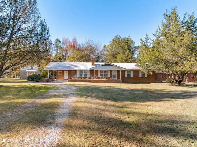 ranch-style home with a porch and a front yard