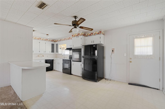 kitchen featuring black appliances, sink, kitchen peninsula, ceiling fan, and white cabinetry