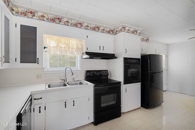 kitchen featuring black appliances, white cabinetry, and sink