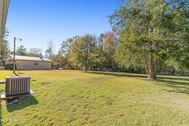 view of yard featuring central AC