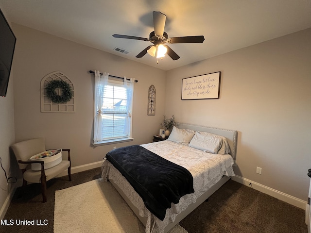 bedroom featuring ceiling fan and dark carpet