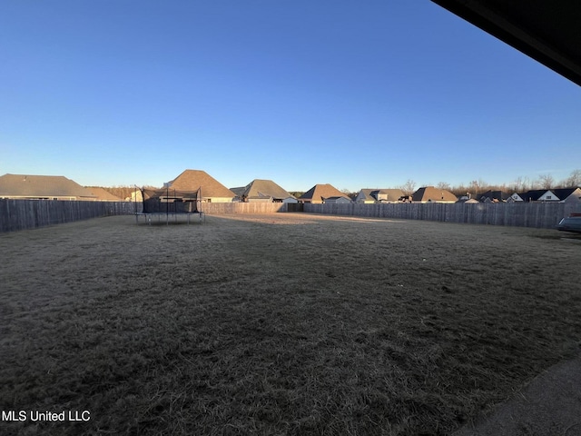 view of yard featuring a trampoline