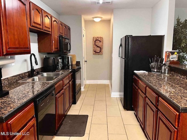2290 Monica Dr, Gulfport, MS 39507 - kitchen with black appliances, a sink, dark countertops, and light tile patterned floors