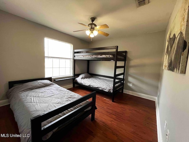 2290 Monica Dr, Gulfport, MS 39507 - bedroom featuring baseboards, wood finished floors, and a ceiling fan