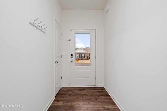 doorway to outside with dark hardwood / wood-style floors